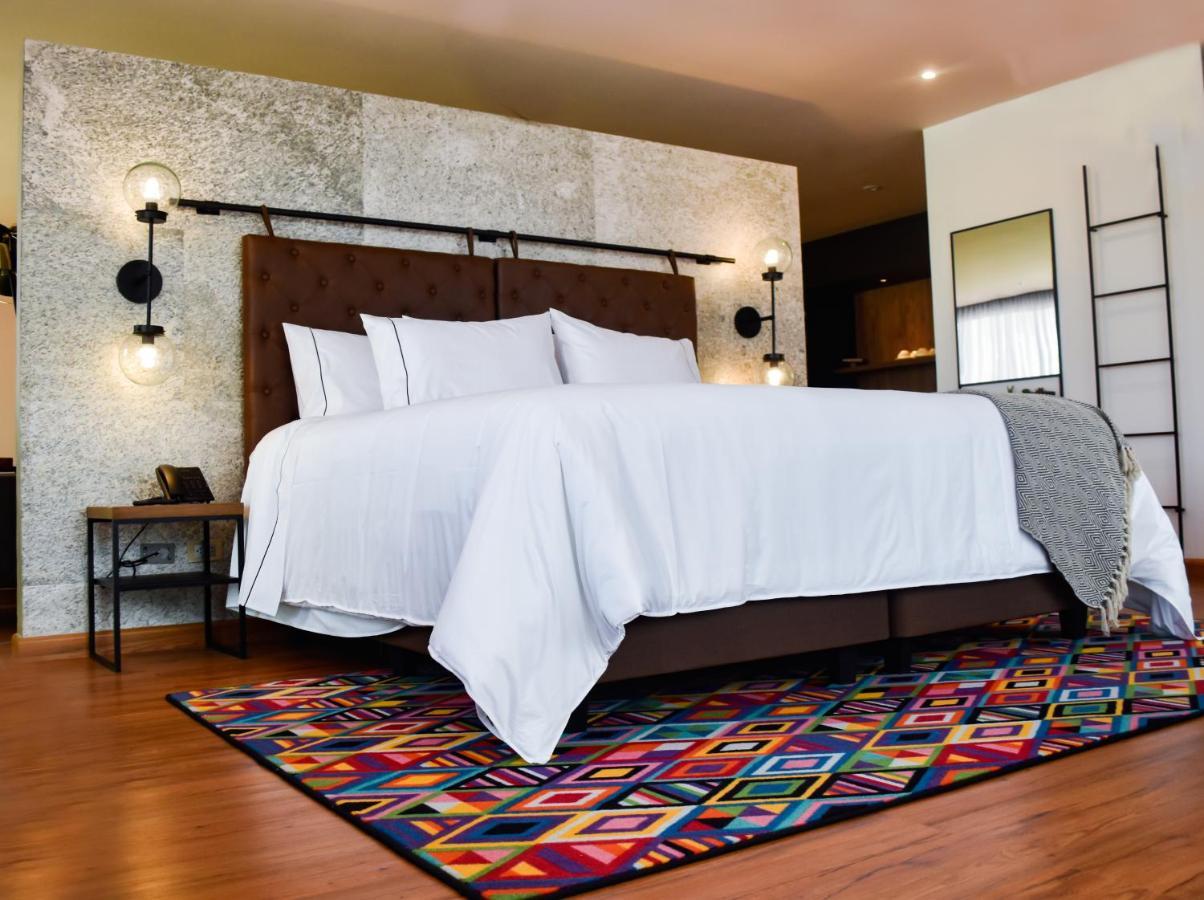 פאסטו Hotel V1501 מראה חיצוני תמונה A bedroom with a carpet