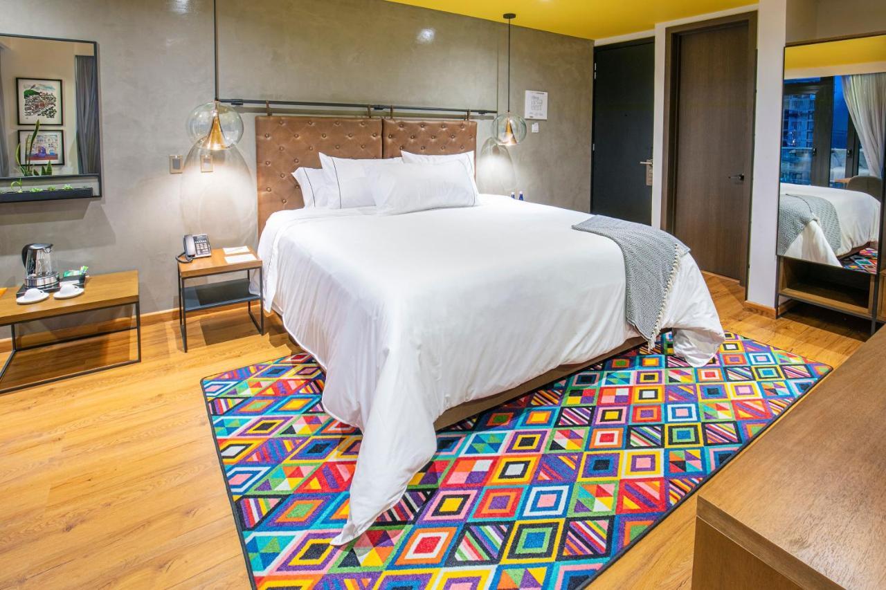 פאסטו Hotel V1501 מראה חיצוני תמונה A carpet in a bedroom